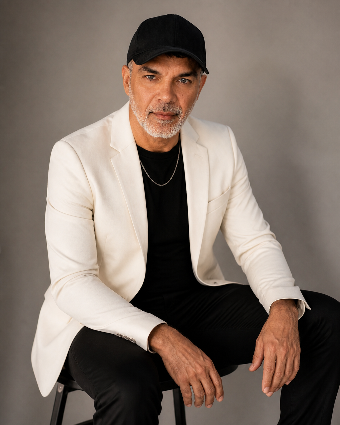 Sotis Mikros in a white suit